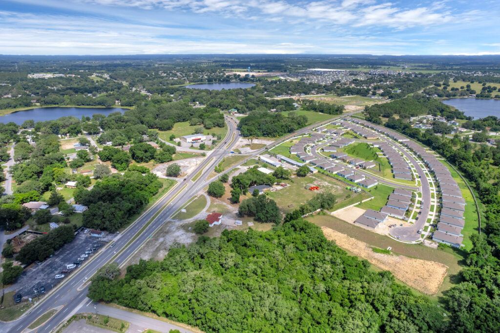 334 e myers blvd. mascotte aerial view of housing development behind property